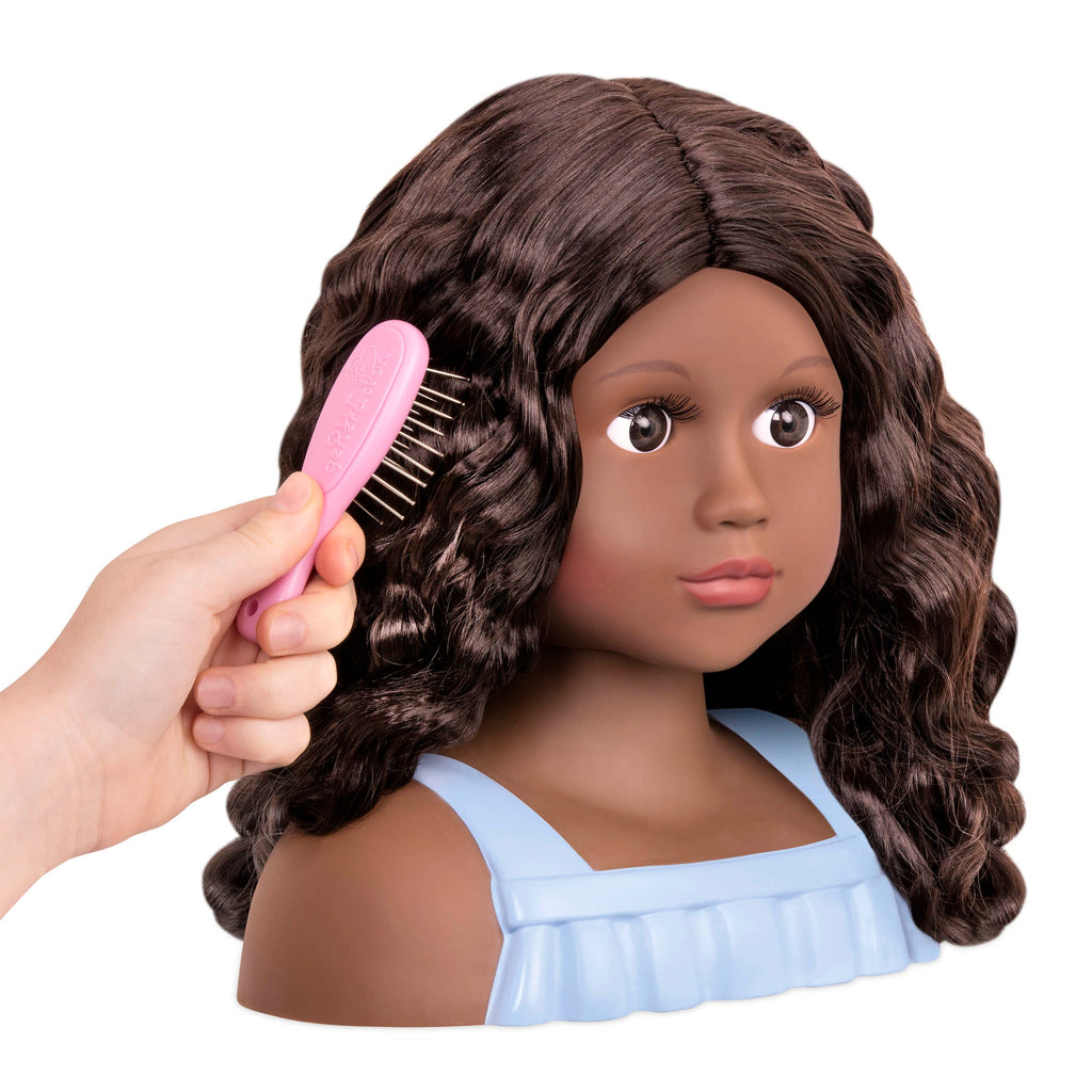 Brunette doll styling head with hair accessories
