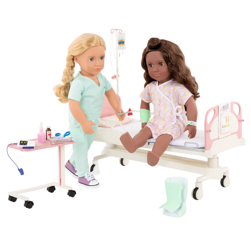 Two 18-inch dolls with hospital gurney playset
