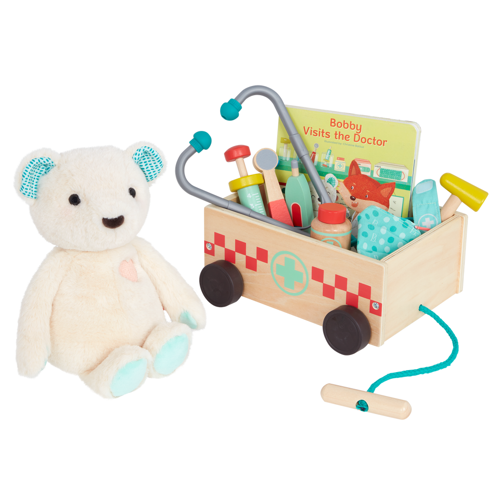 Teddy bear with book, wagon and wooden doctor tools for kids.