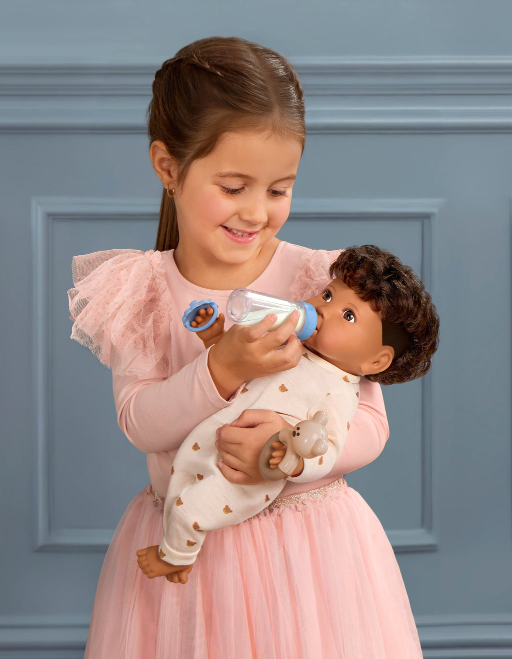 LullaBaby boy doll with brown hair in teddy bear outfit