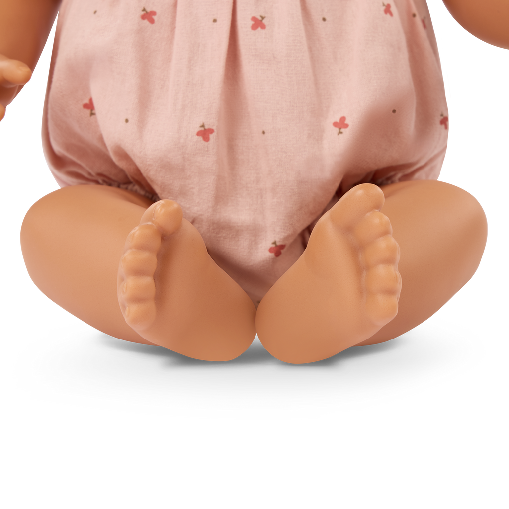 LullaBaby doll with brown hair in pink outfit
