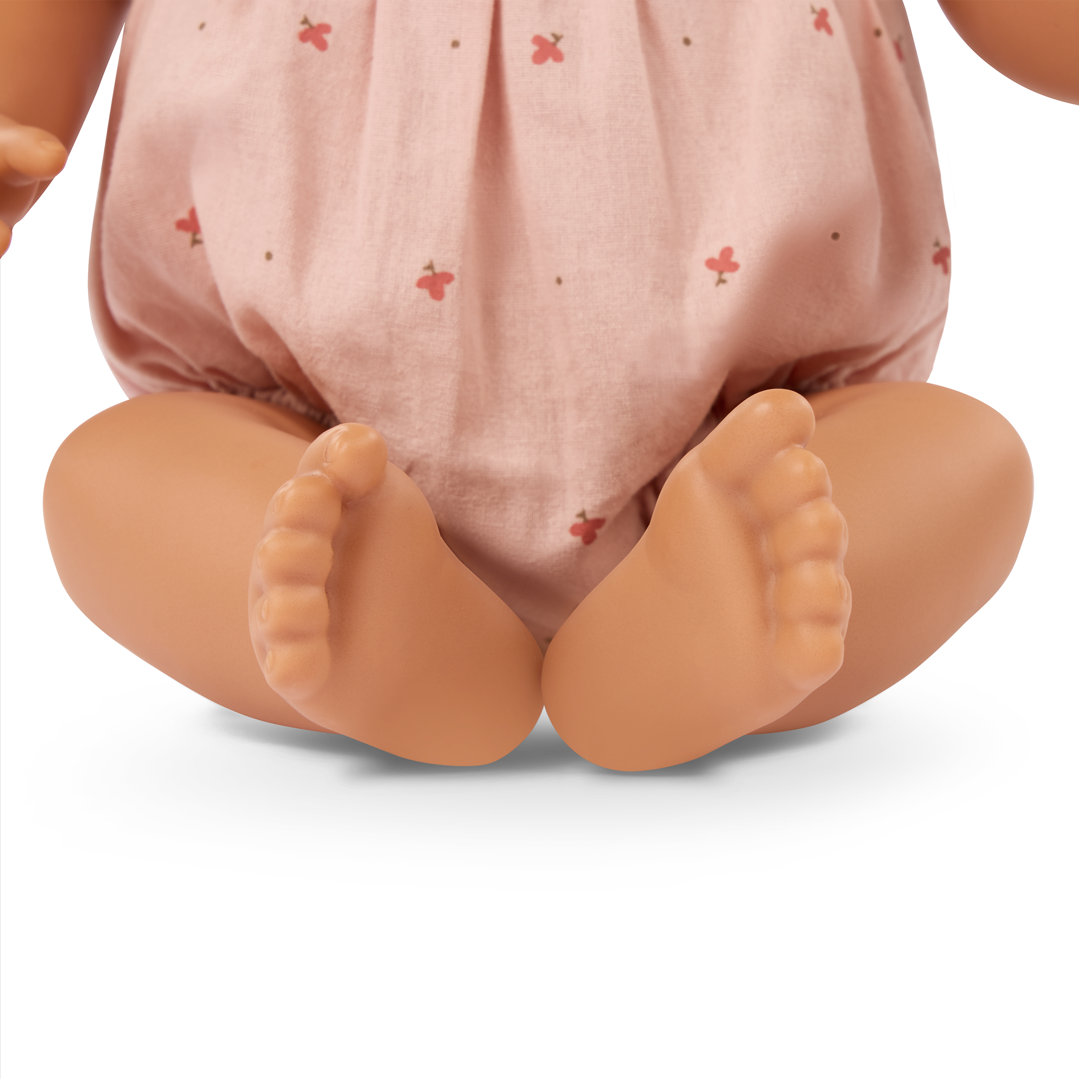 LullaBaby doll with brown hair in pink outfit